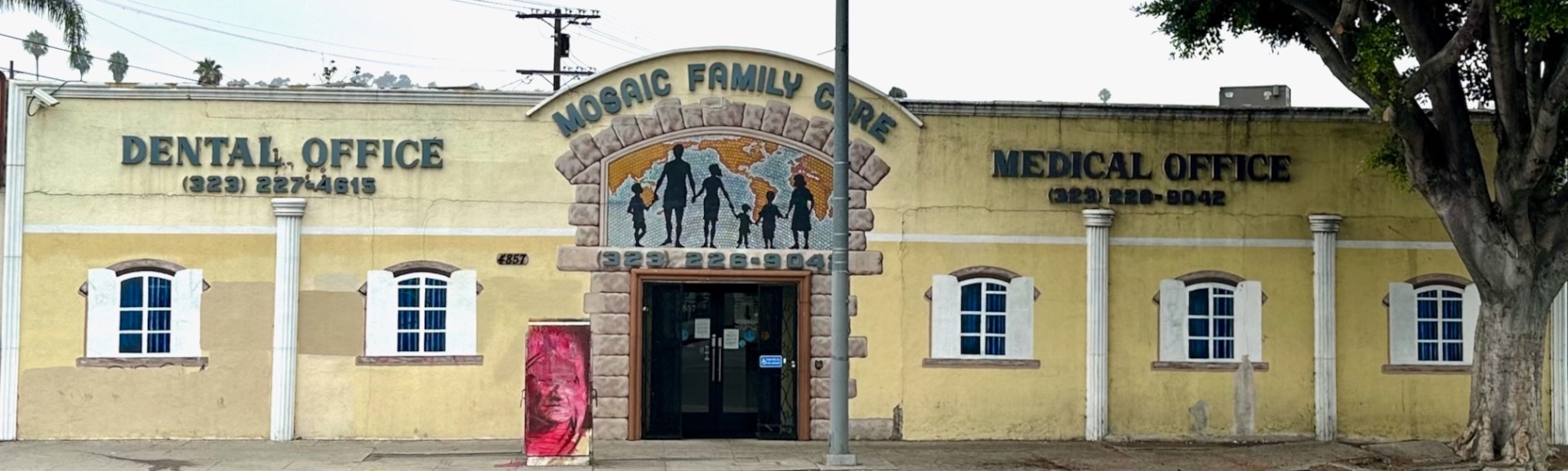 Mosaic Family Care exterior before: faded yellow, peeling, neglected